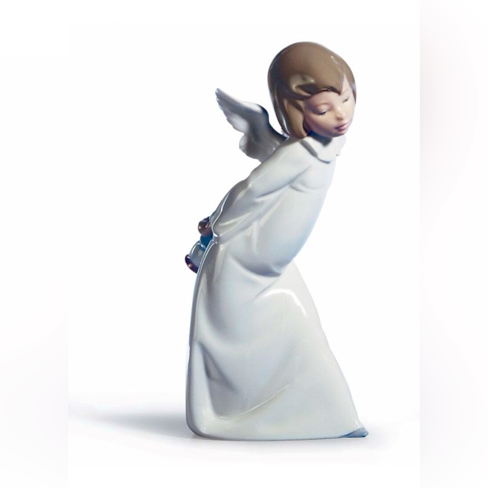 Lladro Curious Angel figurine